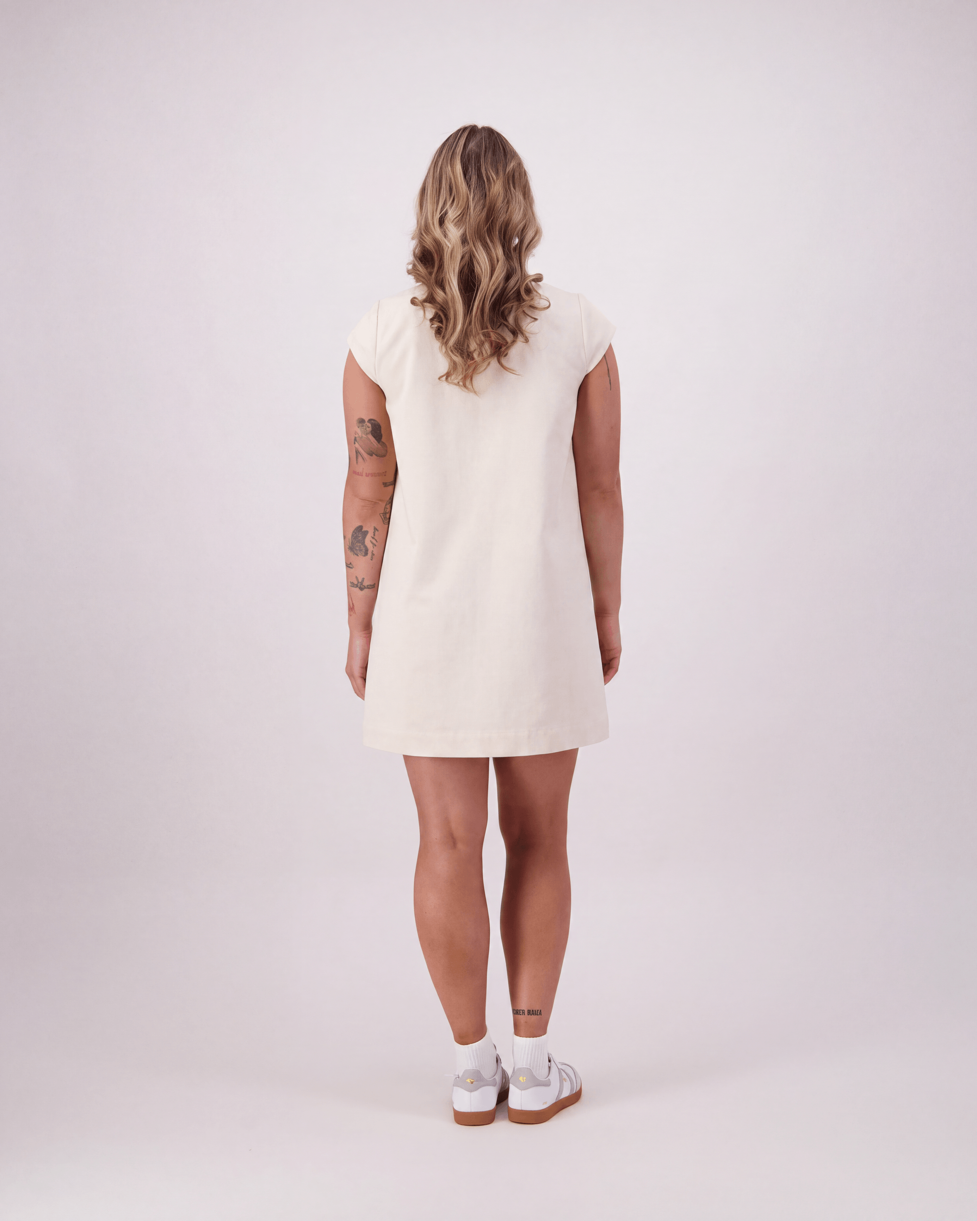 The Coppins by Lennox St. in natural - A-line organic cotton mini dress, back view. 